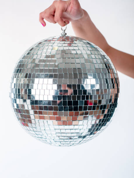 istock Hand holding Disco Ball dance music event equipment 1283871053