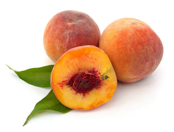 istock Sliced peach and leaves. 1283871361