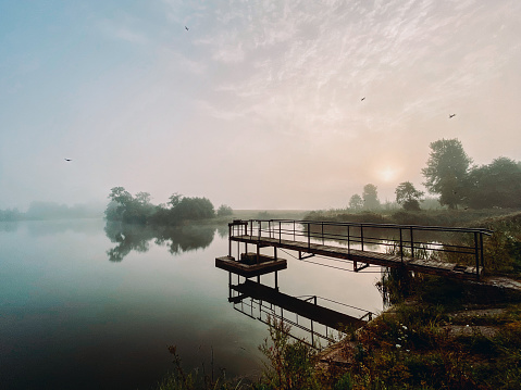 A lake at dawn in the mist near Barta, Latvia