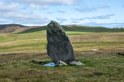 The isolated, single standing stone at Bordastubble on the island of Unst in Shetland, Scotland. Perhaps standing stones in Shetland were ancient markers of important places.