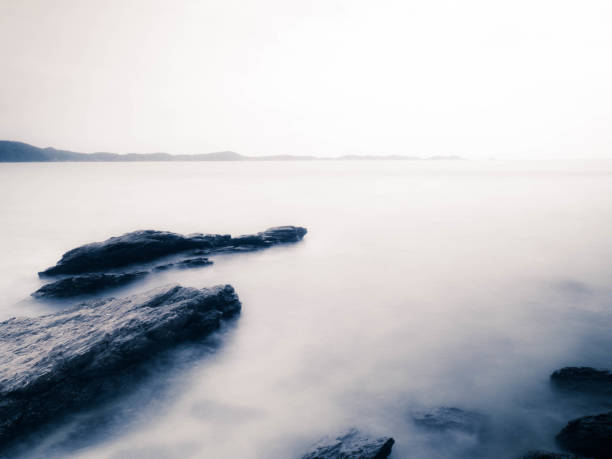 Long Exposure of Sea with Smooth Wave and Rock landscape. Nature of Seascape vacation holiday season time for relax travel