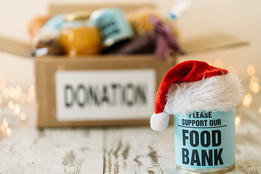 Food Bank Canned Food with Christmas Hat and  Goods Collection with Filled Cardboard Box