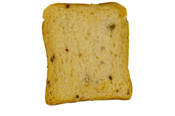 istock Slice of olive bread with spices isolated on white background 1283875447