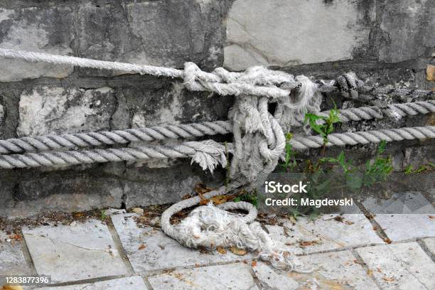 Navy Knots On A Rope At The Mooring On The Dock Stock Photo - Download Image Now - Architecture, Arrival, Building Exterior