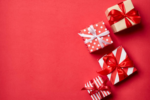 istock Christmas gift box, Christmas ball Ornaments on red background top flat layout blank copy space for text. 1283877702