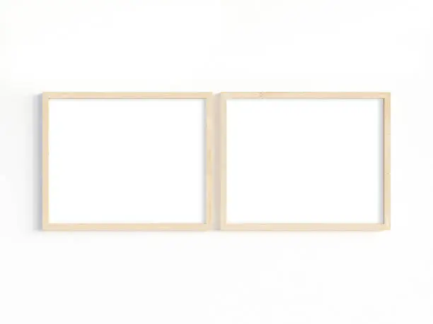 Two wooden horizontal frames 8x10 on a light background. Mockup of 2 frames to display your work. 3D illustration.