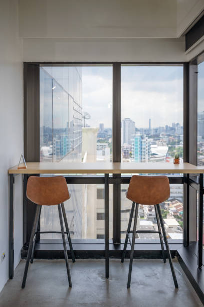 istock Wooden desk with chairs at corner modern office 1283879410
