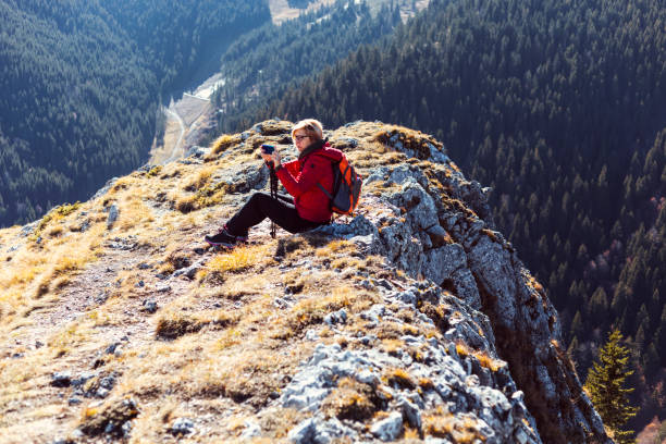 istock Woman traveler in a mountains 1283879590