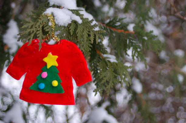 mini red knit Santa coat on white background with copy space