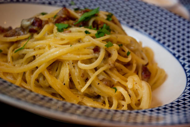 istock Cooked Linguini pasta, in white and blue plate 1283880538