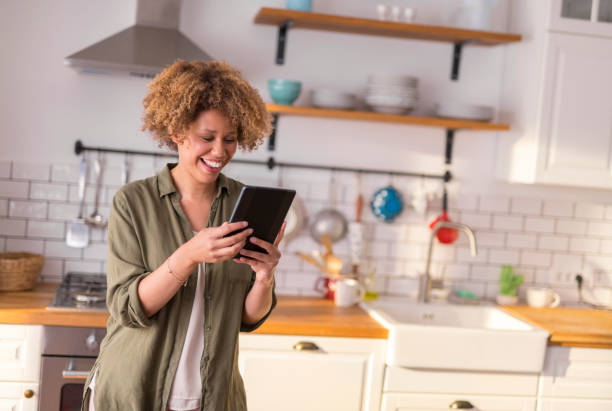 istock Young woman having video call on digital tablet 1283880720