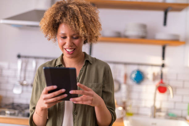 istock Young woman having video call on digital tablet 1283880771