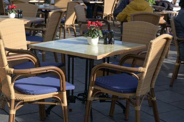 istock Empty table in a street cafe at a sunny day after the strict lockdown during the coronavirus pandemic 1283880834