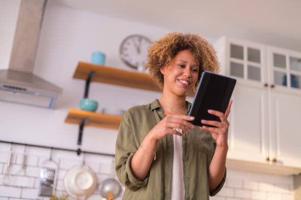 istock Young woman having video call on digital tablet 1283880847