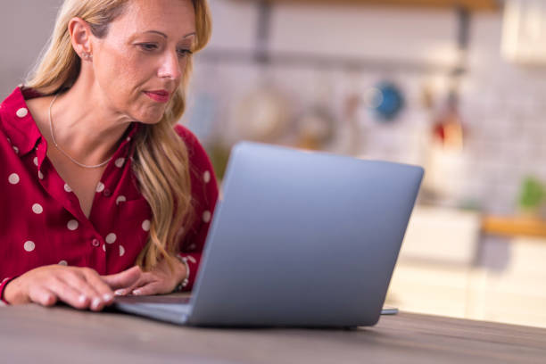 istock Mature woman working from home 1283880874