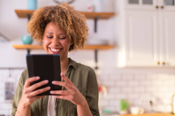 istock Young woman having video call on digital tablet 1283880889
