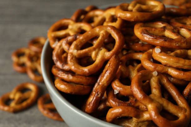 istock Bowl with tasty cracker pretzels on gray table, close up 1283883956