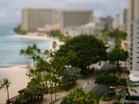 Tilt shift morning view of empty Waikiki Beach and City in Honolulu, HI, United States
