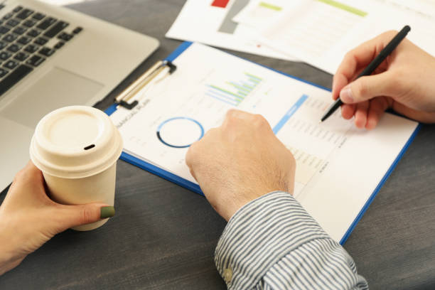 istock Business partners doing a financial planning on black wooden table 1283889029