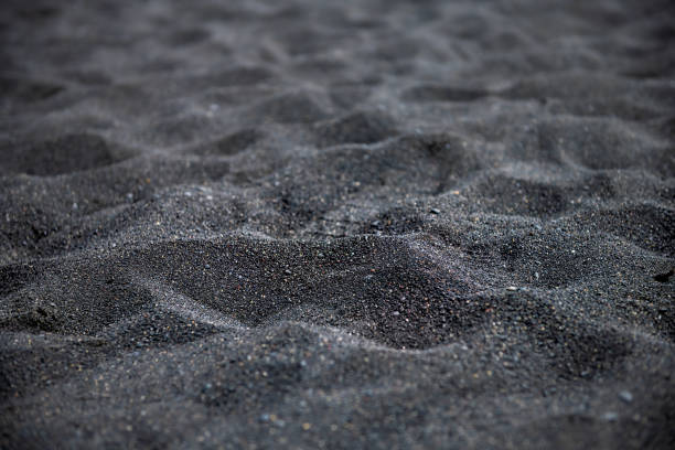 Iceland abstract view of Reynisfjara black sand beach in Vik volcanic lava texture closeup and nobody Iceland abstract view of Reynisfjara black sand beach in Vik volcanic lava texture closeup and nobody volcanic landscape stock pictures, royalty-free photos & images