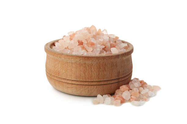 istock Bowl with pink himalayan salt isolated on white background 1283891375