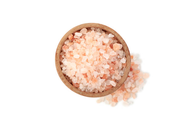 istock Bowl with pink himalayan salt isolated on white background 1283891447