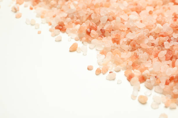istock Pink himalayan salt on white background, space for text 1283891553