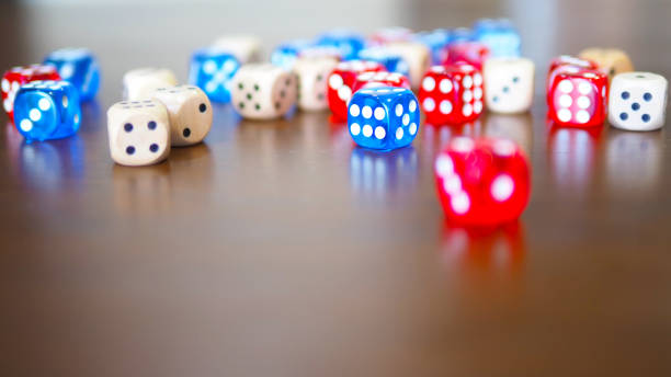 istock blue and red dices game on wooden table top selected focus 1283891622