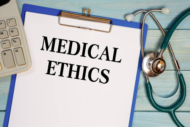 istock Worksheet with the inscription MEDICAL ETHICS, stethoscope and calculator 1283891735