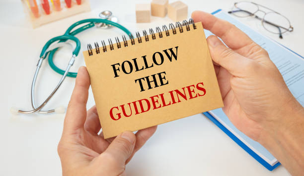 istock Notepad with the inscription FOLLOW THE GUIDELINES and stethoscope 1283891739