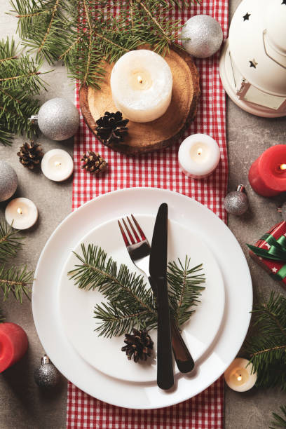 istock Concept of New year table setting with candles on gray table 1283893282
