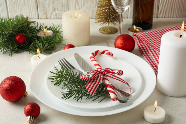 istock Concept of New year table setting with candles on white table 1283893387