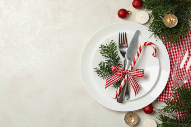 istock Concept of New year table setting with candles on white table 1283893602