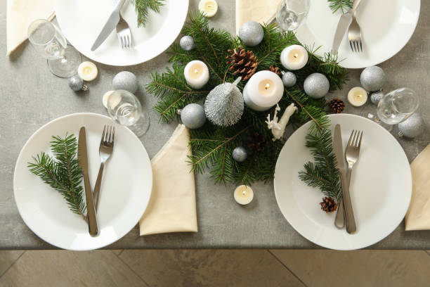 istock Concept of romantic New year table setting on gray table 1283893649