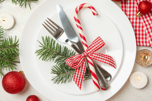 istock Concept of New year table setting with candles on white table 1283894289