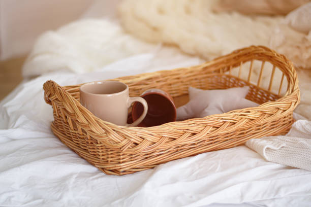 istock Two coffee mugs on a tray. Tray with two mugs on a bed 1283897201