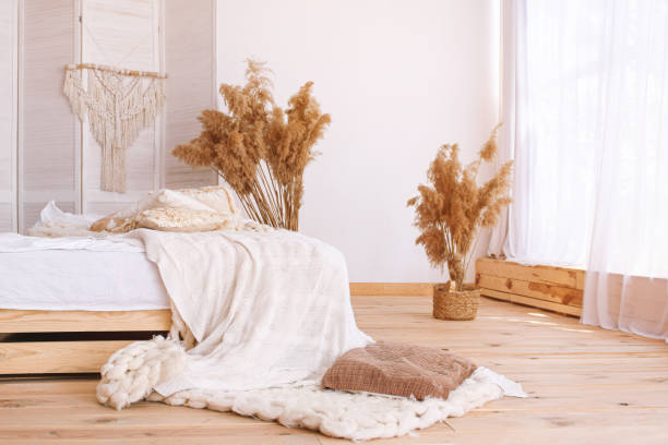 istock Bedroom interior with bed and orange home decor 1283897302
