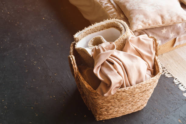 istock Wicker basket with fabric. Brown fabric in wicked basket. 1283897767