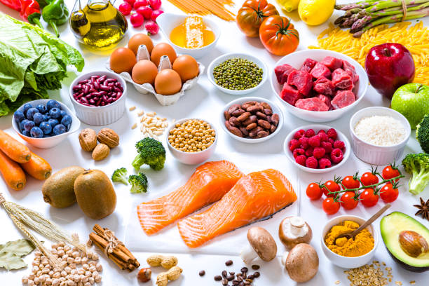 istock Assortment of various kinds of food types on withe background 1283897810