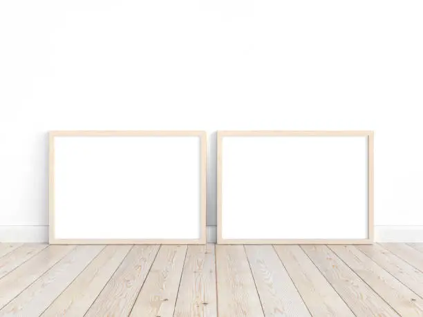 Two wooden horizontal frames A4 on the floor. Mockup of 2 frames to display your work. 3D illustration.
