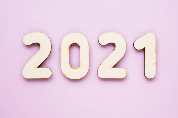 istock Wooden numbers 2021 on a pink background, copy space, flat layout. Minimalist Christmas concept. New year 2021 1283899788