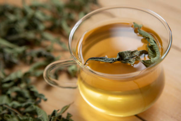 istock Healthy melissa tea natural organic aromatic drink in glass cup 1283899982