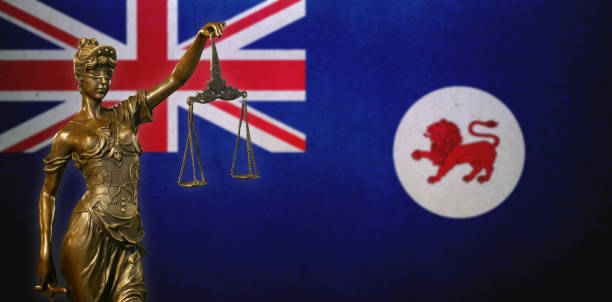istock Lady Justice before a flag of Tasmania 1283900875