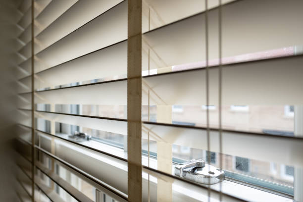 istock Title	 Shallow focus of a chrome lock seen on an internal apartment window. 1283901621