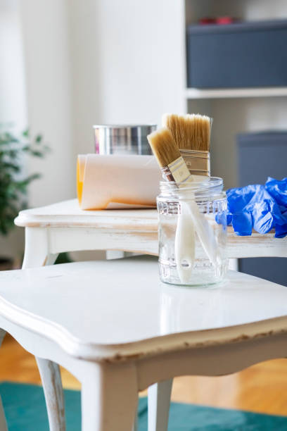 istock Painting an old wooden table at home 1283901672