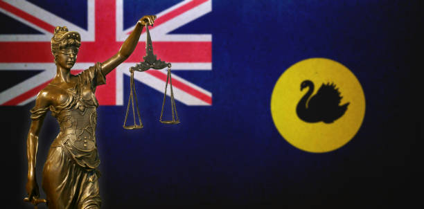 istock Lady Justice before a flag of Western Australia 1283902248