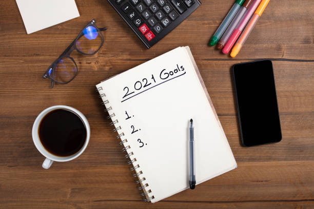 istock New Year's Solution Goal List 2021. Handwritten notebook about New Year's goals and resolutions plan list. 1283903954