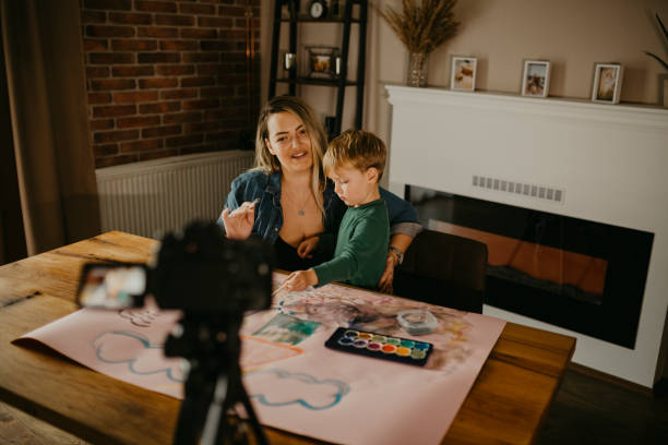 istock Mother makes a VLOG while she paints with her son 1283904023