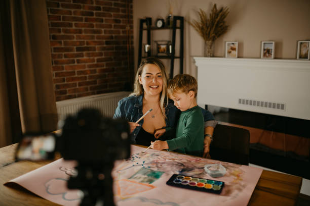 istock Mother makes a VLOG while she paints with her son 1283904179