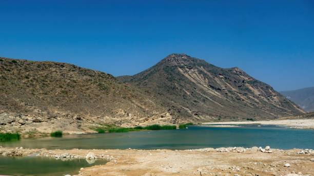 istock Mountain and sea water in mughsail 1283904832